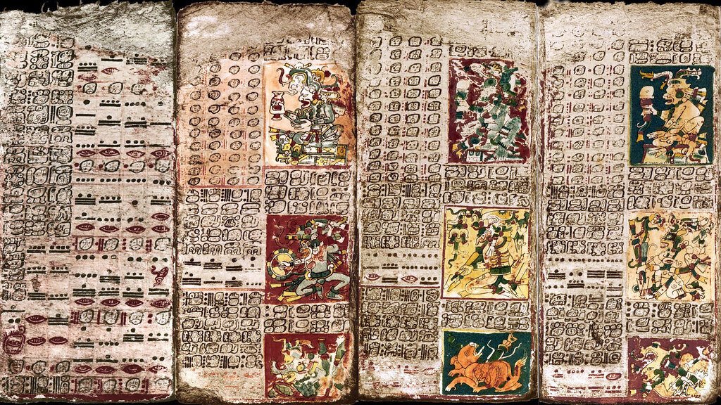 Painted pages of the Maya Dresden Codex covered in glyphs and numbers