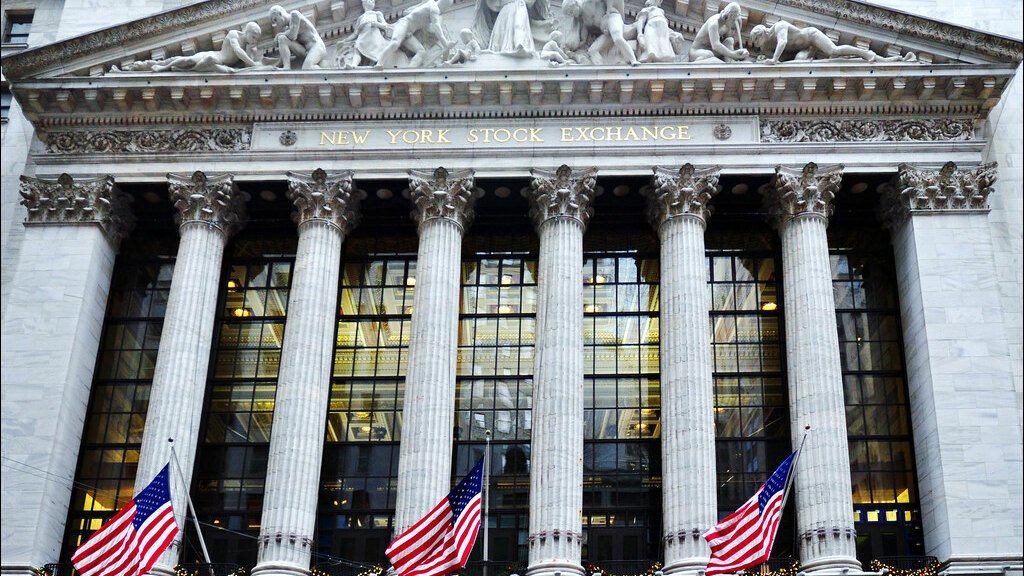 The New York Stock Exchange building on Wall Street, decorated with American flags